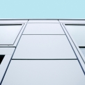 Detail styku skleněné fasády s panely Trimo Qbiss